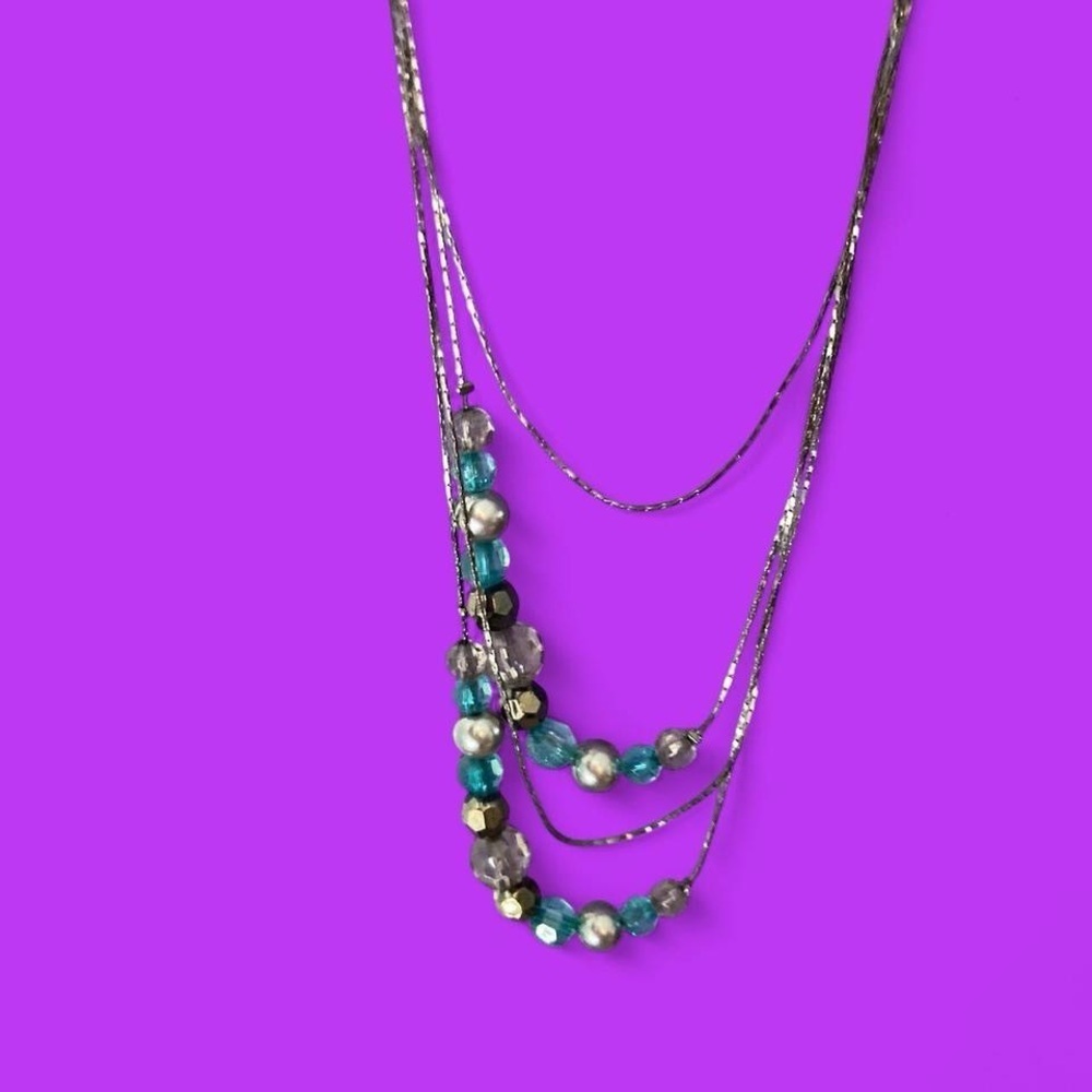 Silvertone and blue beaded necklace with a touch of boho charm